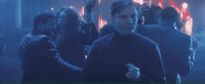 A Shield With The Letter A On It Is Surrounded By A Crowd Of People GIF