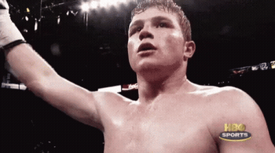 A Shirtless Boxer In A Boxing Ring With Hbo Sports Written On His Chest GIF