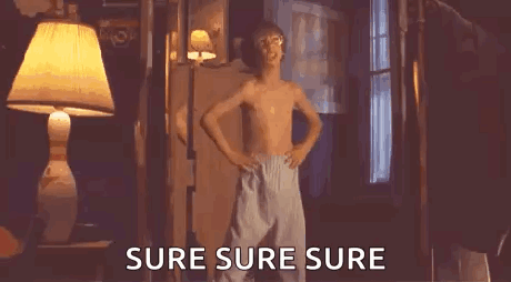 A Shirtless Boy Is Dancing In A Room With The Words `` Sure Sure Sure '' Written Next To Him . GIF