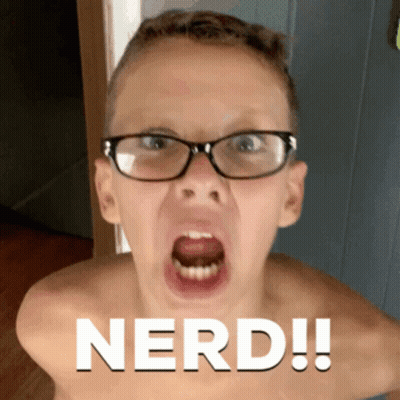 A Shirtless Boy Wearing Glasses Is Making A Funny Face And The Word Nerd Is On The Bottom GIF