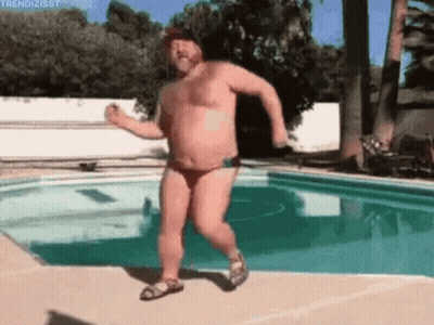 A Shirtless Man In A Bikini Is Dancing Next To A Swimming Pool . GIF