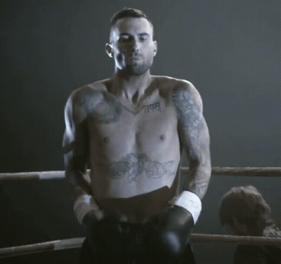 A Shirtless Man In A Boxing Ring Has A Tattoo On His Chest That Says " I Am " GIF
