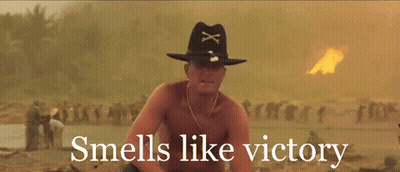 A Shirtless Man In A Cowboy Hat With The Words " Smells Like Victory " Below Him GIF