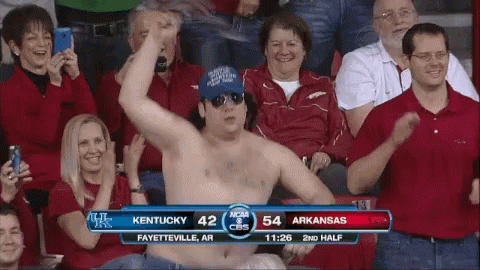 A Shirtless Man In A Crowd Watches A Game Between Kentucky And Arkansas On Cbs GIF