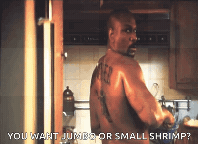 A Shirtless Man In A Kitchen With The Words You Want Jumbo Or Small Shrimp GIF