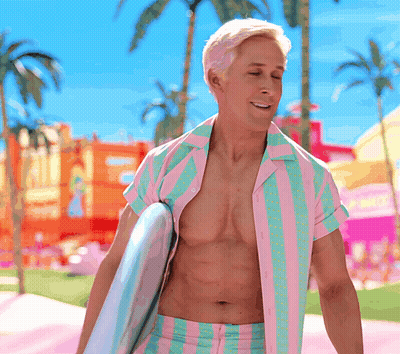 A Shirtless Man In A Pink And Green Striped Shirt Holds A Surfboard GIF