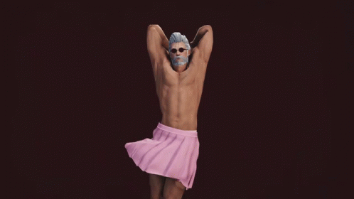 A Shirtless Man In A Pink Skirt Stands Next To A Drawing GIF