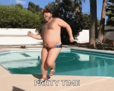 A Shirtless Man In A Red Swim Trunks Is Dancing In A Swimming Pool . GIF