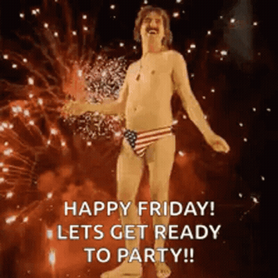 A Shirtless Man In An American Flag Swim Suit Is Dancing In Front Of Fireworks . GIF