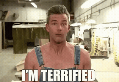 A Shirtless Man In Overalls Says I 'M Terrified In A Workshop GIF