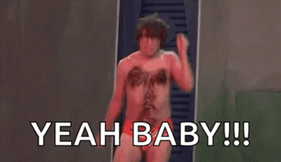 a shirtless man in red underwear is standing in front of a door and shouting .