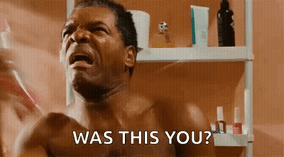 A Shirtless Man Is Brushing His Teeth In A Bathroom And Asking , Was This You ? GIF
