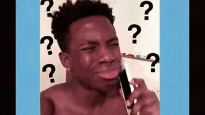 A Shirtless Man Is Crying While Talking On A Cell Phone With Question Marks Around His Head . GIF