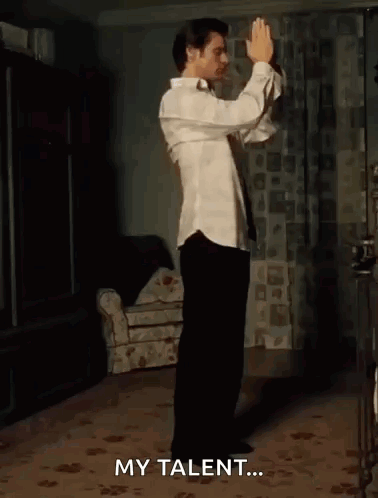 A Shirtless Man Is Dancing In A Room With The Words My Talent Written On The Bottom . GIF