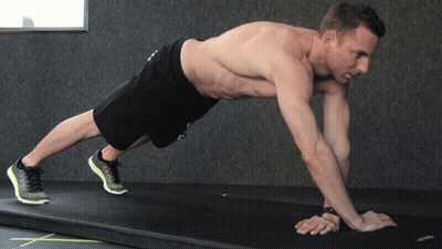 A Shirtless Man Is Doing A Plank On A Mat GIF