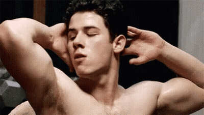 A Shirtless Man Is Doing Exercises With His Hands Behind His Head In A Bathroom . GIF