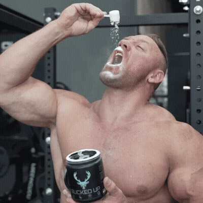 A Shirtless Man Is Drinking From A Can That Says Bucked Up On It GIF