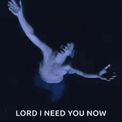 A Shirtless Man Is Floating In The Water With His Arms Outstretched And The Words `` Lord I Need You Now '' . GIF