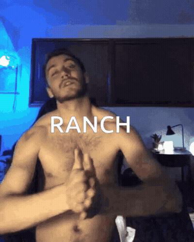 A Shirtless Man Is Giving A Thumbs Up In Front Of A Sign That Says Ranch GIF