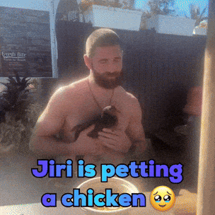 A Shirtless Man Is Holding A Chicken In His Arms With The Caption Jiri Is Petting A Chicken GIF