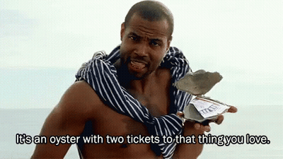 A Shirtless Man Is Holding An Oyster With Two Tickets To That Thing You Love .. GIF