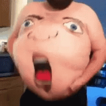 A Shirtless Man Is Holding His Belly With A Stuffed Face On It . GIF