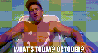 A Shirtless Man Is Laying In A Swimming Pool With A Smiley Face On His Chest . GIF