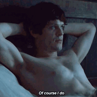 A Shirtless Man Is Laying On A Bed And Saying Of Course I Do GIF