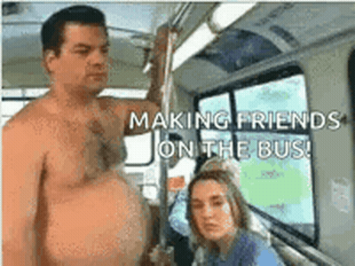 a shirtless man is making friends on the bus