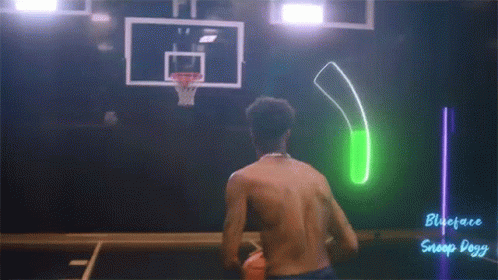 A Shirtless Man Is Playing A Game Of Basketball With A Green Light Behind Him That Says Snoop Dogg On It GIF