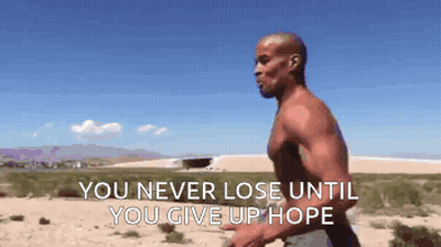 A Shirtless Man Is Running In The Desert With The Words " You Never Lose Until You Give Up Hope " On The Bottom GIF