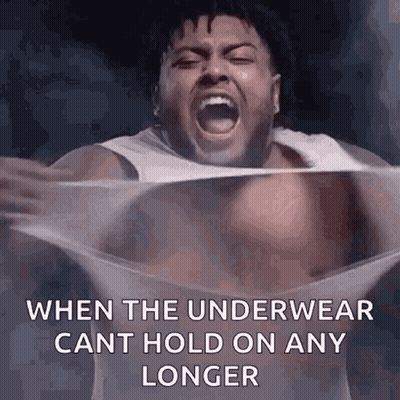 A Shirtless Man Is Screaming While Holding A Piece Of Plastic . GIF