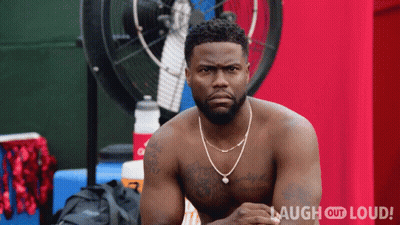 A Shirtless Man Is Sitting In Front Of A Fan With Laugh Out Loud Written On The Bottom Right GIF