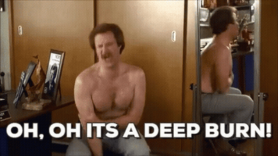 A Shirtless Man Is Sitting In Front Of A Mirror And Saying `` Oh , Oh It 'S A Deep Burn '' . GIF