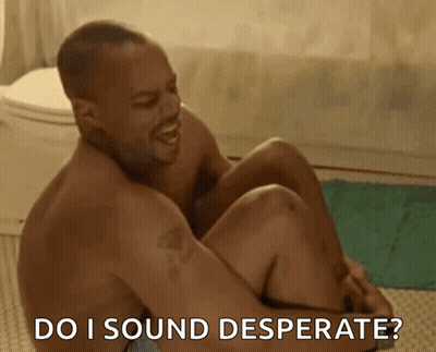 A Shirtless Man Is Sitting On The Floor With The Words Do I Sound Desperate Behind Him GIF