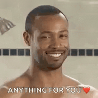 A Shirtless Man Is Smiling And Saying `` Anything For You '' In A Shower . GIF