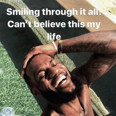 A Shirtless Man Is Smiling In A Pool With The Words Smiling Through It All Can 'T Believe This My Life Below Him GIF