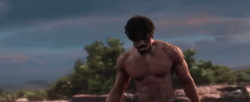 A Shirtless Man Is Standing In A Field With The Words `` Is This Your King '' . GIF