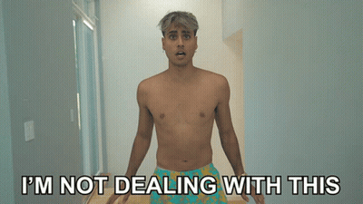 A Shirtless Man Is Standing In A Hallway With The Words I 'M Not Dealing With This Behind Him GIF