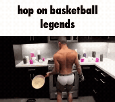 A Shirtless Man Is Standing In A Kitchen Holding A Pan And A Pancake . GIF