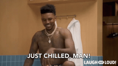 A Shirtless Man Is Standing In A Locker Room And Says Just Chilled Man GIF