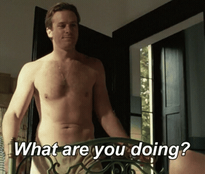 A Shirtless Man Is Standing In Front Of A Door And Asking " What Are You Doing " GIF