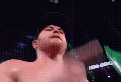A Shirtless Man Is Standing In Front Of A Hbo Box Office Sign GIF