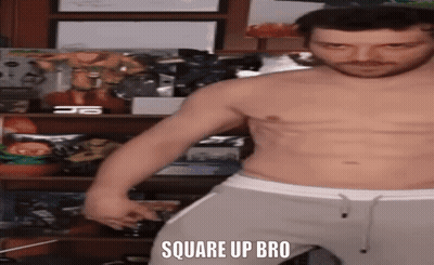 A Shirtless Man Is Standing In Front Of A Shelf With The Words Square Up Bro Written On It GIF