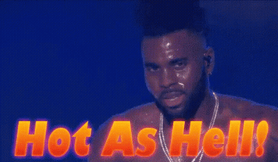 A Shirtless Man Is Standing In Front Of A Sign That Reads Hot As Hell GIF
