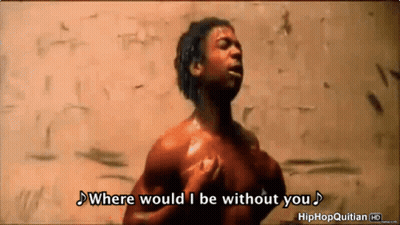 A Shirtless Man Is Standing In Front Of A Wall And Singing Where Would I Be Without You GIF