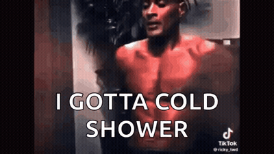 A Shirtless Man Is Standing In Front Of A Wall With The Words `` I Gotta Cold Shower '' . GIF