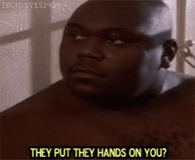 A Shirtless Man Is Standing In Front Of A Window Talking To Someone . GIF