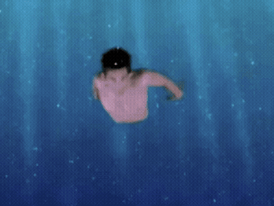 A Shirtless Man Is Swimming In A Pool GIF