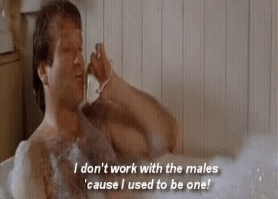 A Shirtless Man Is Taking A Bath In A Bathtub While Shaving His Beard . GIF